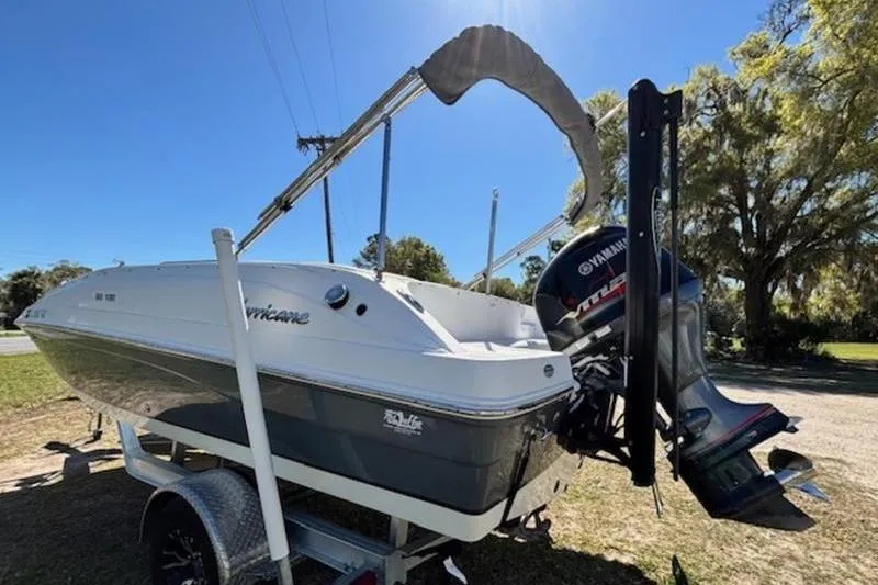Slide: The Image of 2019 Hurricane SunDeck Sport 188 OB boat with Yamaha outboard motor on trailer. - 5