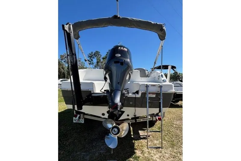 Slide: The Image of 2019 Hurricane SunDeck Sport 188 OB boat, rear view with outboard motor and ladder. - 6