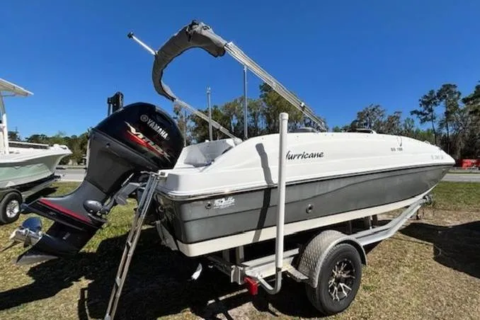 Slide: The Image of 2019 Hurricane SunDeck Sport 188 OB boat on trailer with Yamaha outboard motor. - 8