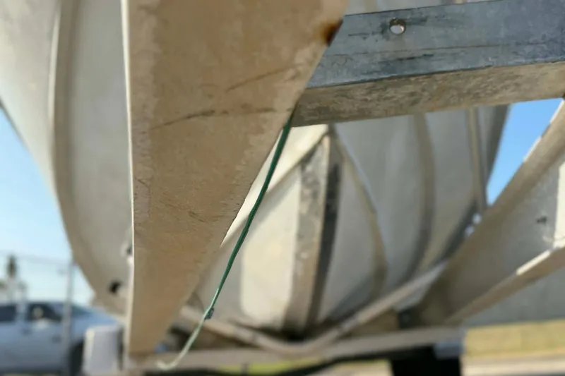 Slide: The Image of Close-up of a 2000 Boston Whaler Justice 24 boat hull on a trailer. - 7