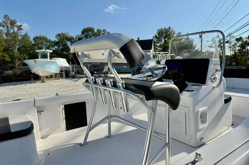 Slide: The Image of 2026 Tidewater 180 CC Adventure boat on trailer outside dealership. - 1