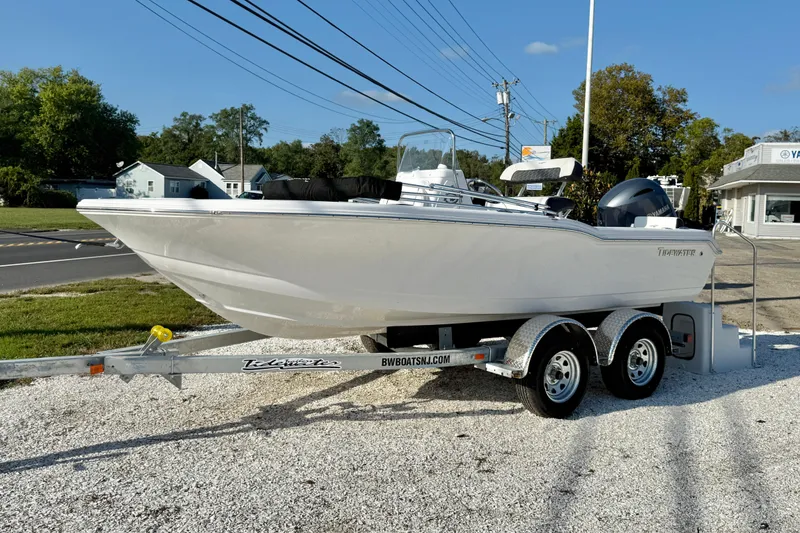 Slide: The Image of 2026 Tidewater 180 CC Adventure boat on trailer in parking lot. - 2
