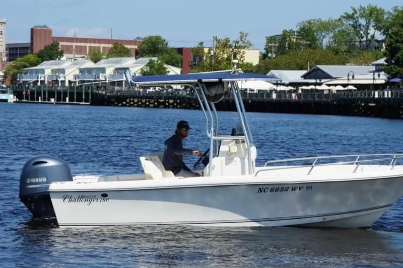 The Image of 2002 KenCraft Challenger 180 boat cruising on a river with a Yamaha engine. - 1