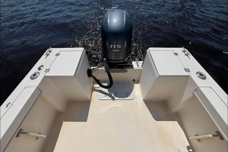 Slide: The Image of 2002 KenCraft Challenger 180 boat with Yamaha 115 outboard motor on water. - 11