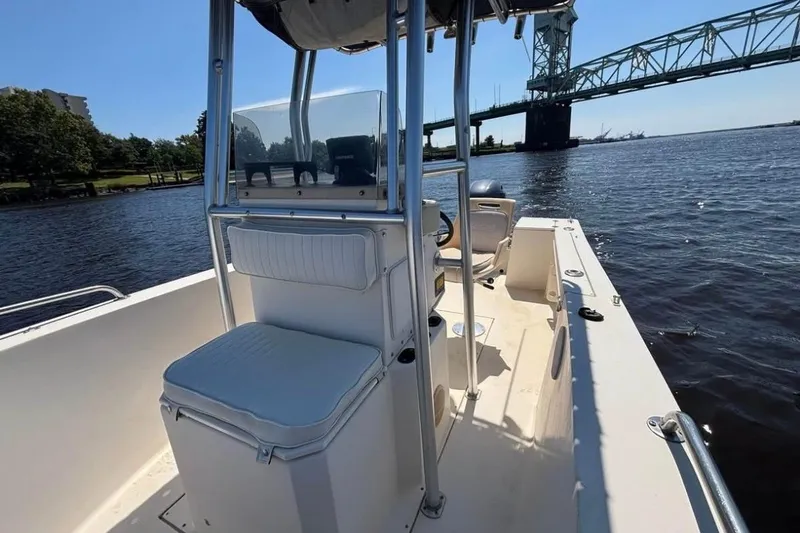 Slide: The Image of 2002 KenCraft Challenger 180 boat on water near a bridge, sunny day. - 7