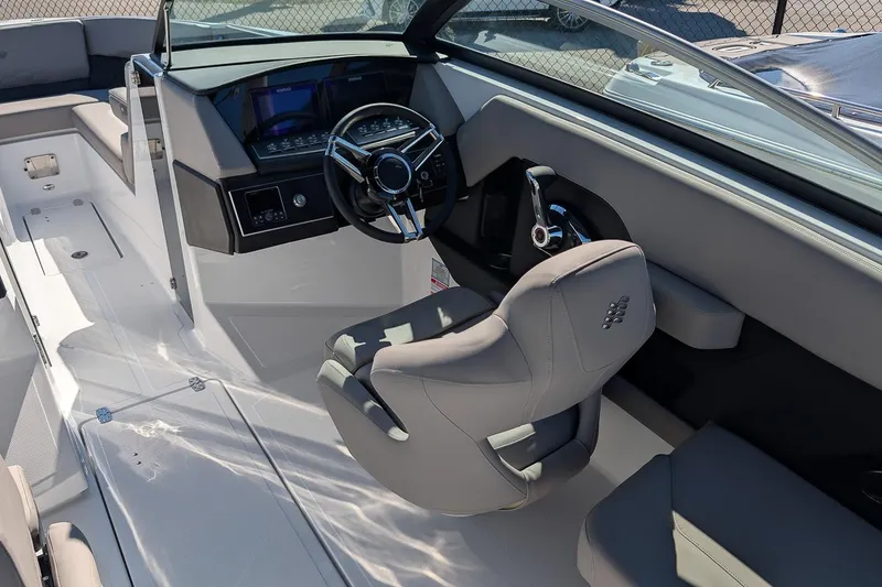 Slide: The Image of 2026 Four Winns H6 OB boat interior with modern steering and dashboard. - 11