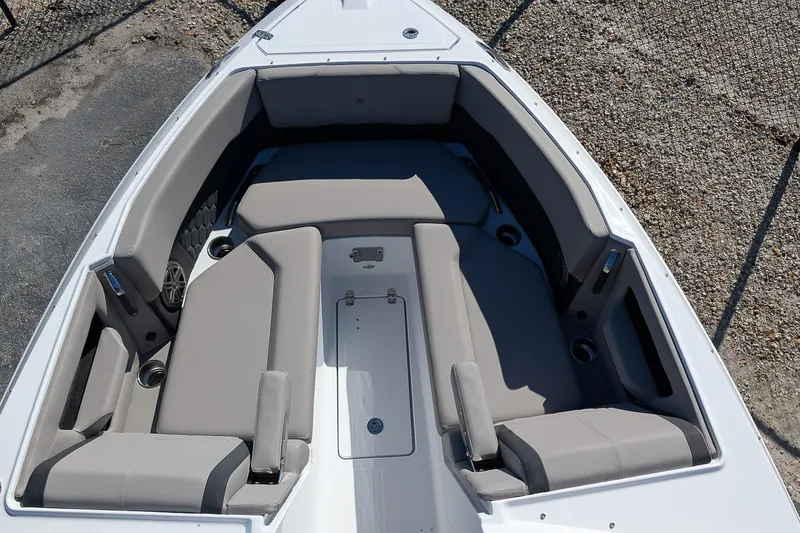 Slide: The Image of 2026 Four Winns H6 OB boat interior with spacious seating and cup holders. - 19