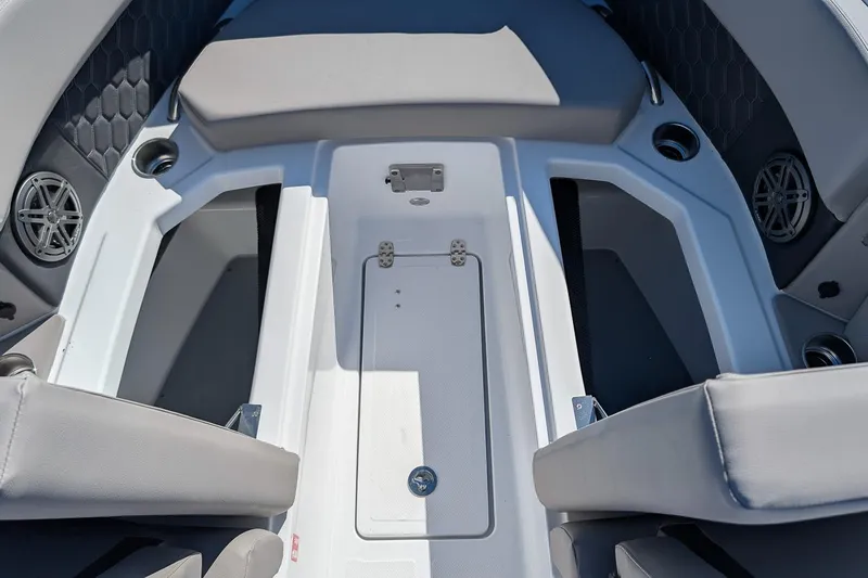 Slide: The Image of 2026 Four Winns H6 OB boat interior with seating and cup holders. - 21