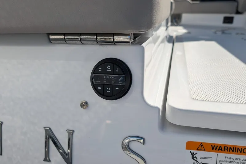 Slide: The Image of 2026 Four Winns H6 OB boat with JL Audio control panel and warning label. - 7