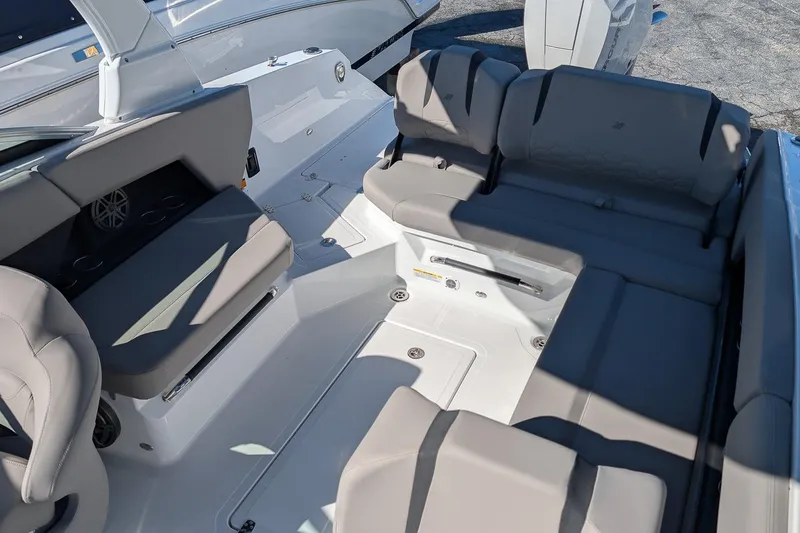 Slide: The Image of Luxurious seating area on 2026 Four Winns H6 OB boat, featuring sleek gray upholstery. - 8