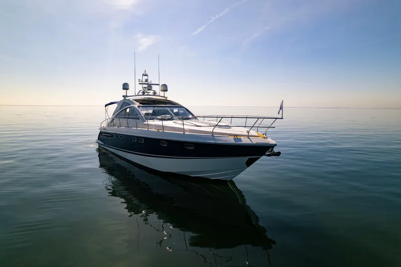 Slide: The Image of 2009 Fairline Targa 52 yacht on calm water under clear sky. - 1