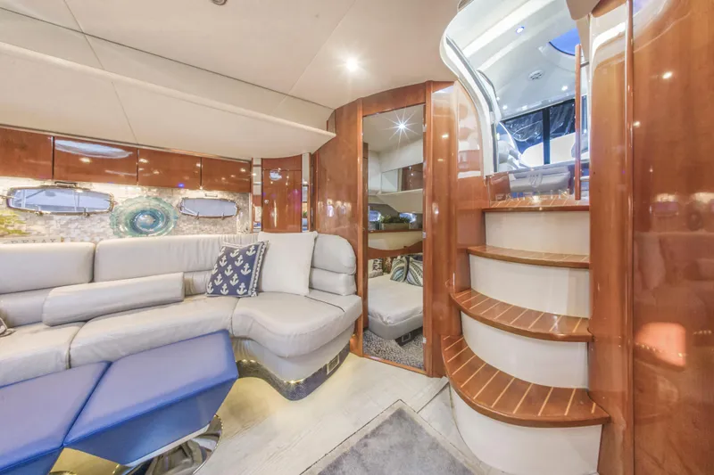 Slide: The Image of Luxurious interior of 2009 Fairline Targa 52 yacht with elegant seating and wooden staircase. - 11