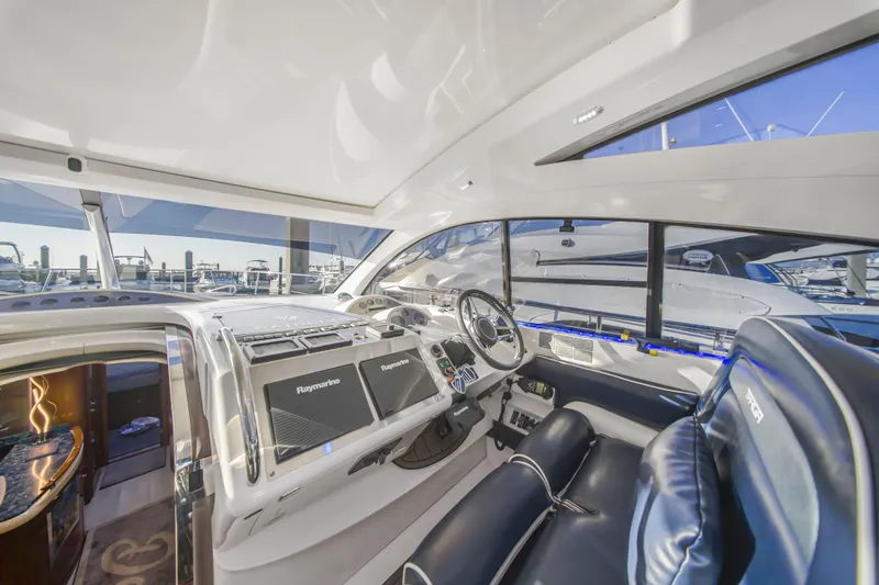 Slide: The Image of Luxurious 2009 Fairline Targa 52 yacht interior with modern navigation equipment. - 12