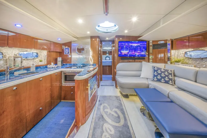 Slide: The Image of Luxurious interior of 2009 Fairline Targa 52 yacht with modern kitchen and seating area. - 15