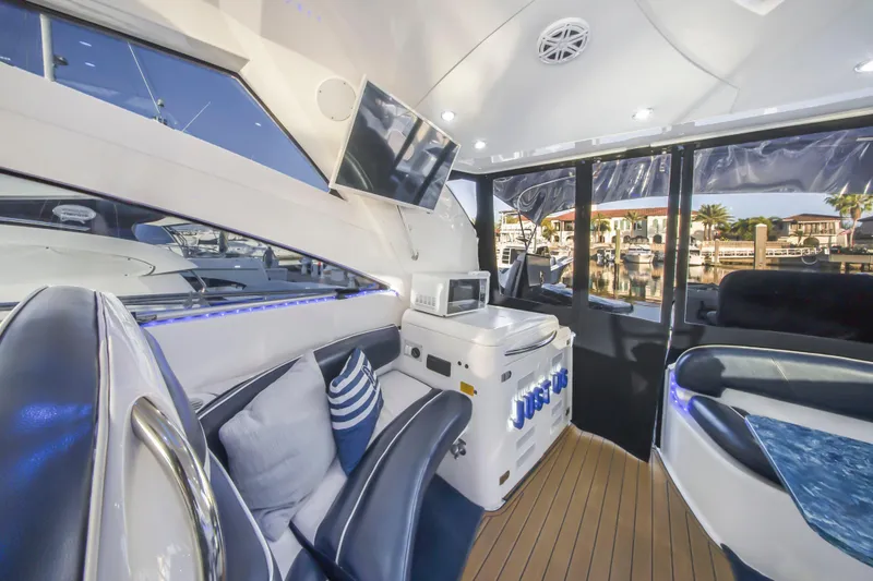 Slide: The Image of Luxurious interior of 2009 Fairline Targa 52 yacht with modern amenities and stylish seating. - 28