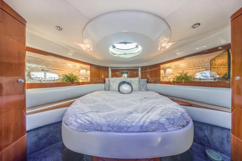 Slide: The Image of Luxurious 2009 Fairline Targa 52 yacht cabin with elegant bedding and wood accents. - 29