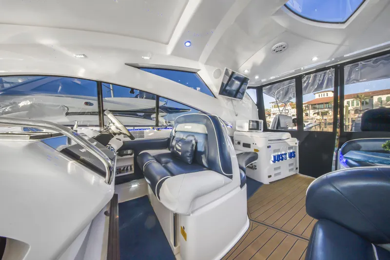 Slide: The Image of Luxurious interior of 2009 Fairline Targa 52 yacht with modern seating and navigation equipment. - 30