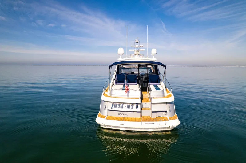 Slide: The Image of 2009 Fairline Targa 52 yacht on calm water under a clear blue sky. - 34
