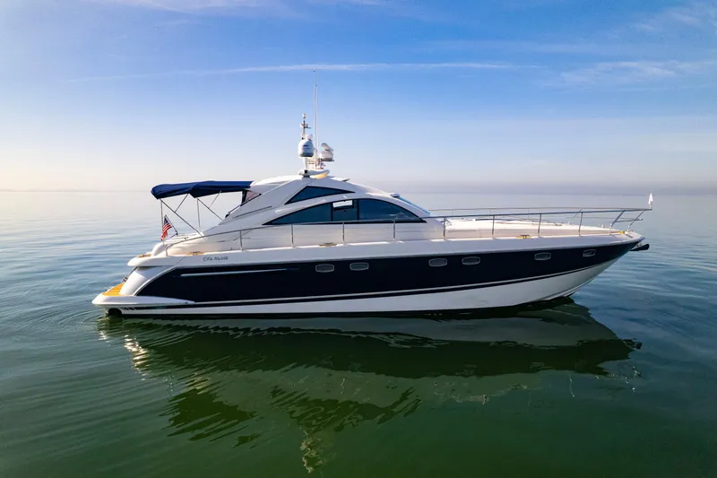 Slide: The Image of 2009 Fairline Targa 52 yacht on calm water under clear blue sky. - 36