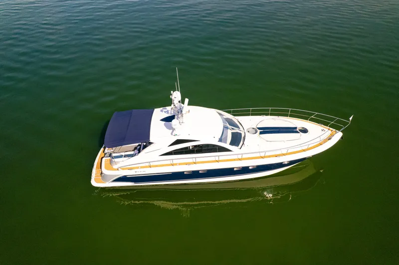 Slide: The Image of 2009 Fairline Targa 52 yacht cruising on calm green waters. - 39