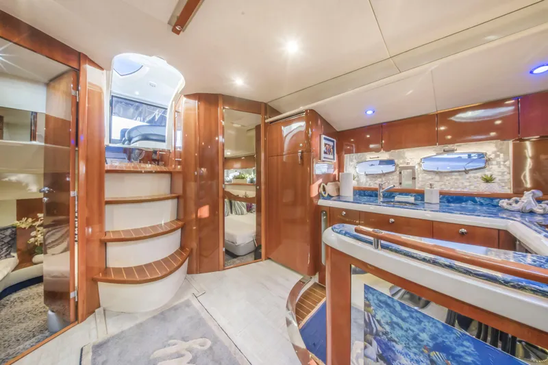Slide: The Image of Luxurious interior of 2009 Fairline Targa 52 yacht with elegant wood finishes and modern amenities. - 7