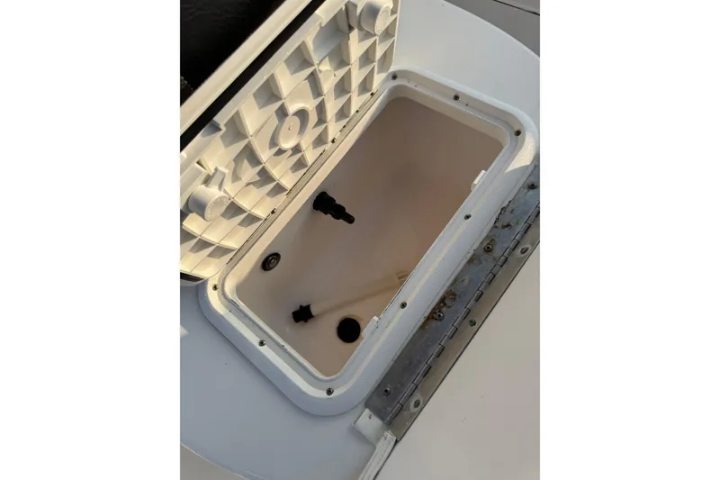 Slide: The Image of Open storage compartment on 2012 Carolina Skiff 21 Ultra Elite boat. - 12