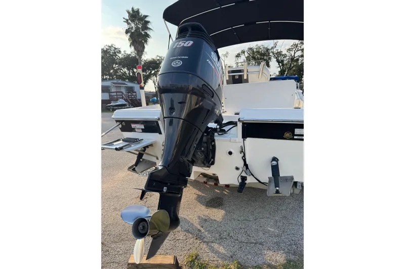 Slide: The Image of 2012 Carolina Skiff 21 Ultra Elite boat with powerful outboard motor. - 16