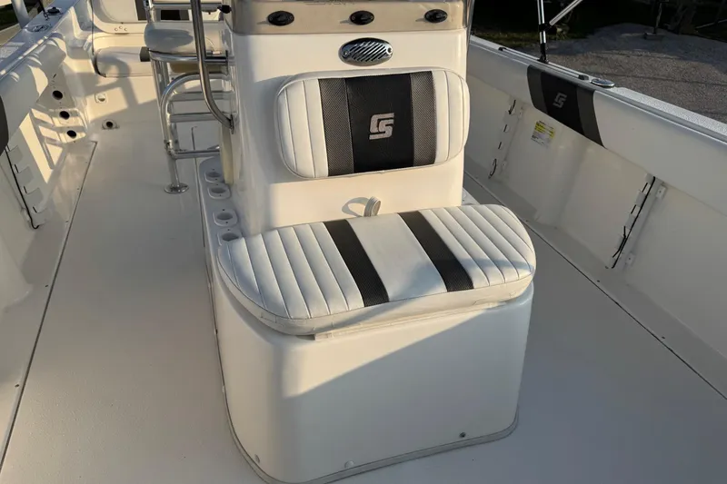 Slide: The Image of 2012 Carolina Skiff 21 Ultra Elite boat interior with cushioned seating and console. - 3
