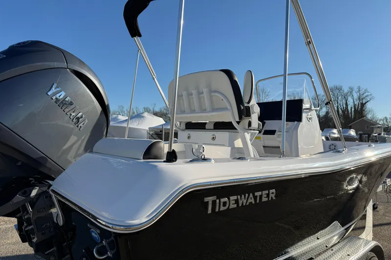 Slide: The Image of 2026 Tidewater 198 CC Adventure boat with Yamaha engine, sleek design, outdoor setting. - 11