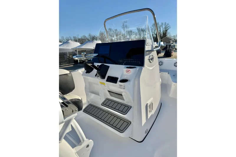 Slide: The Image of 2026 Tidewater 198 CC Adventure boat console with steering wheel and controls. - 13