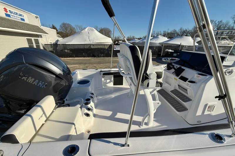 Slide: The Image of 2026 Tidewater 198 CC Adventure boat interior with Yamaha engine, showcasing helm and seating area. - 14
