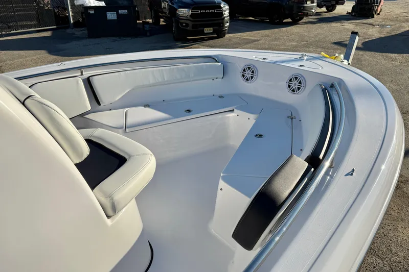 Slide: The Image of 2026 Tidewater 198 CC Adventure boat interior with cushioned seating and speakers. - 15