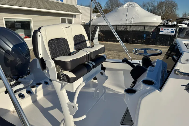 Slide: The Image of 2026 Tidewater 198 CC Adventure boat interior with dual seats and steering console. - 16