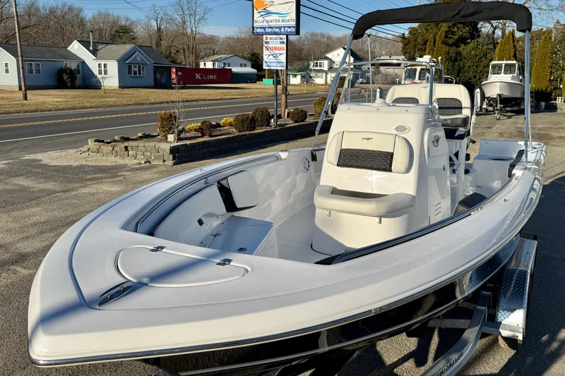 Slide: The Image of 2026 Tidewater 198 CC Adventure boat displayed outdoors on a trailer. - 17