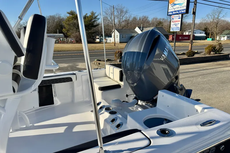Slide: The Image of 2026 Tidewater 198 CC Adventure boat with Yamaha engine, parked outdoors. - 20