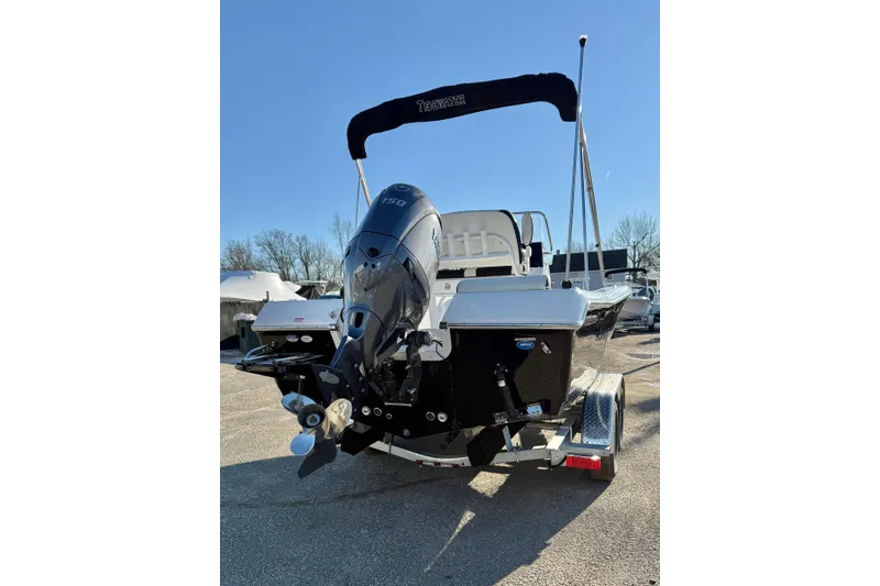 Slide: The Image of 2026 Tidewater 198 CC Adventure boat with outboard motor on trailer. - 6
