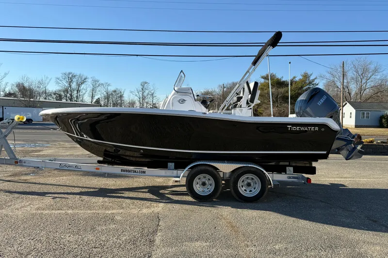Slide: The Image of 2026 Tidewater 198 CC Adventure boat on trailer, side view. - 8