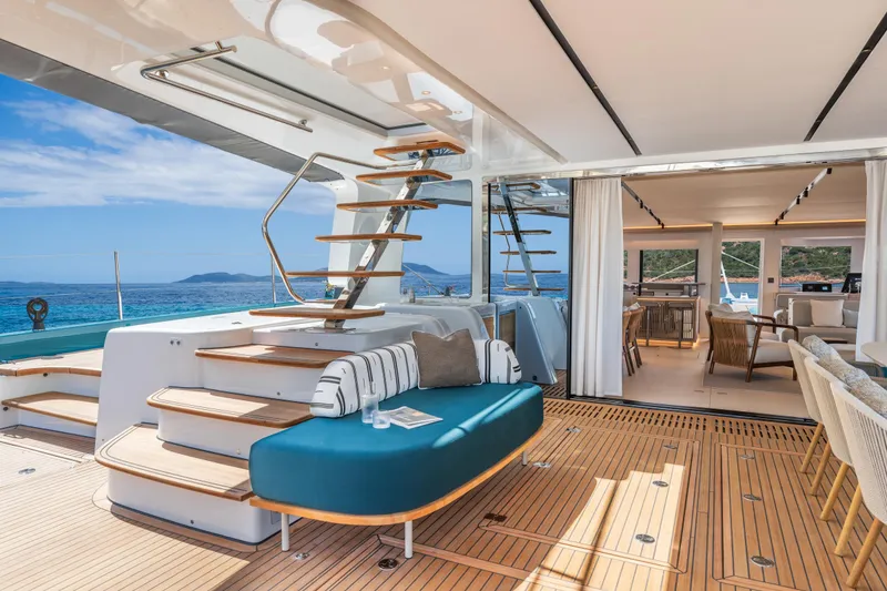 Slide: The Image of Luxurious Lagoon Eighty 2 yacht interior, featuring elegant seating and ocean views, 2025 model. - 12