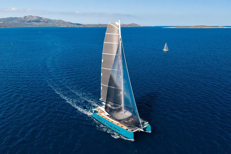 Slide: The Image of 2026 Lagoon Eighty 2 catamaran sailing on open blue sea. - 2