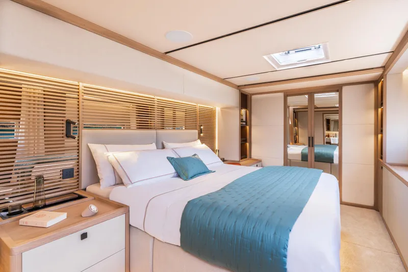 Slide: The Image of Luxurious bedroom interior of 2025 Lagoon Eighty 2 yacht, featuring elegant design and modern amenities. - 26