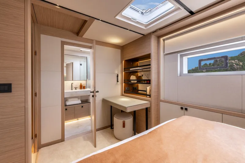 Slide: The Image of Luxurious interior of 2025 Lagoon Eighty 2 yacht cabin with modern design and natural lighting. - 36