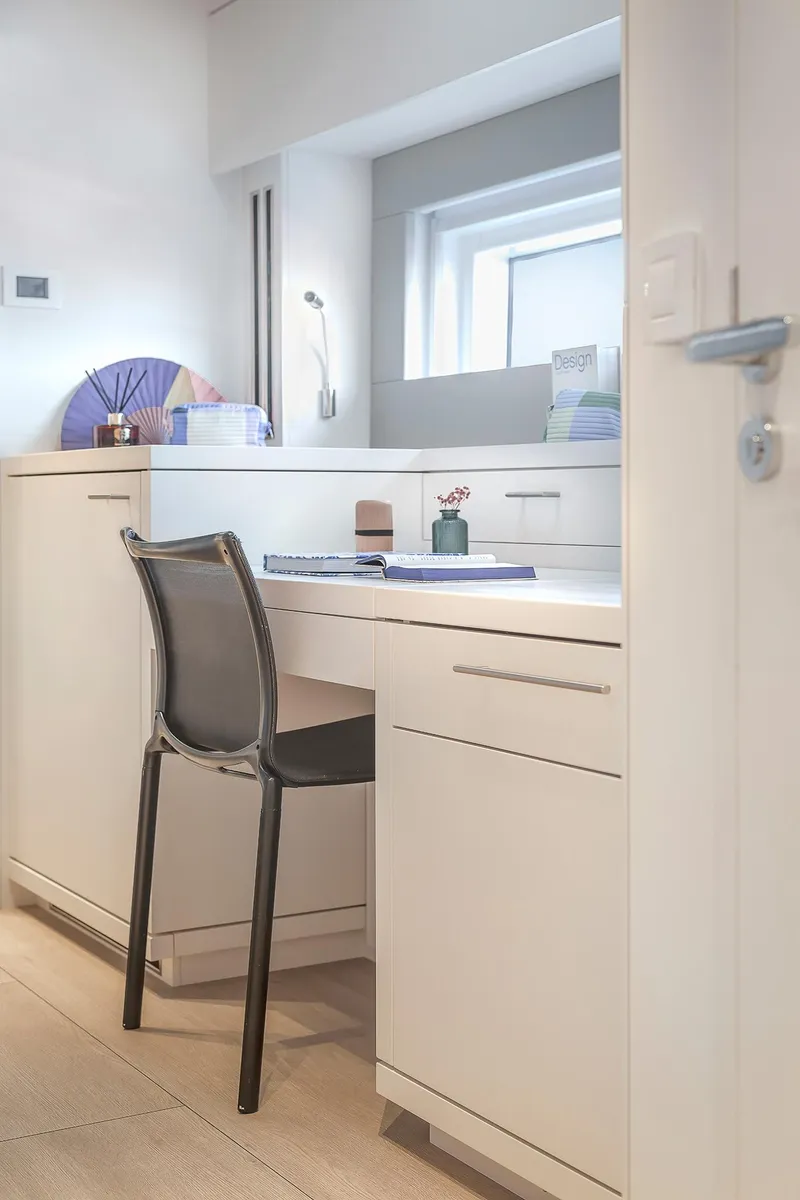 Slide: The Image of Modern interior of Lagoon SIXTY 5 yacht, 2025 model, featuring sleek white cabinetry and minimalist design. - 41