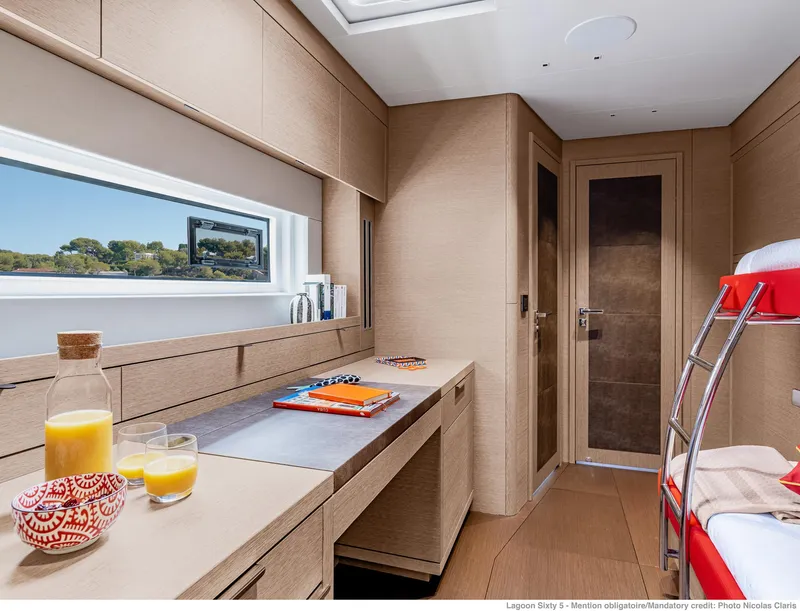 Slide: The Image of Luxurious interior of 2025 Lagoon SIXTY 5 yacht with modern design and natural light. - 48