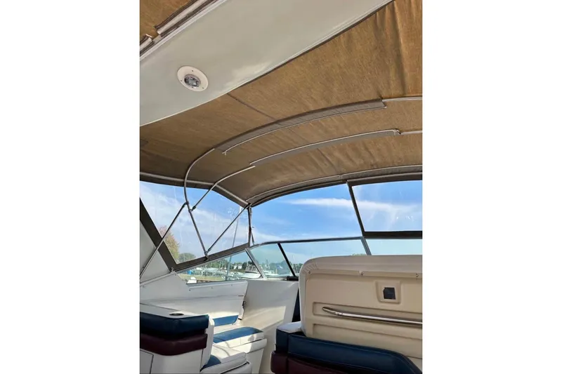 Slide: The Image of 1987 Wellcraft 3400 Gran Sport boat interior with canopy and seating. - 7