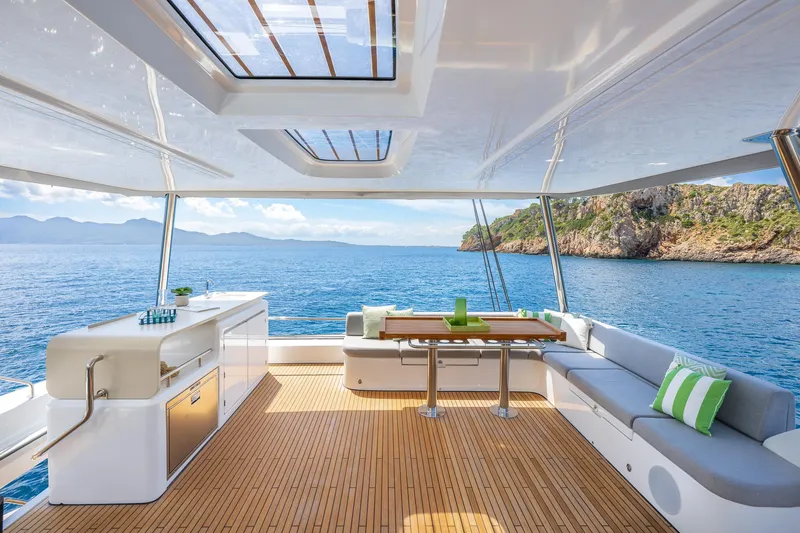 Slide: The Image of Luxurious Lagoon 60 yacht interior, 2025 model, featuring spacious deck with ocean view. - 18