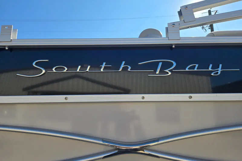 Slide: The Image of 2018 South Bay 200 boat logo against a clear blue sky. - 4