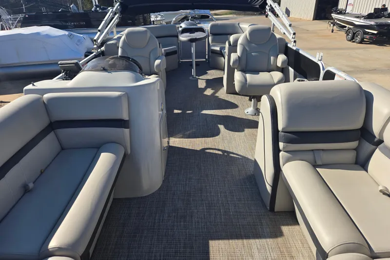 Slide: The Image of Luxurious interior of a 2018 South Bay 200 pontoon boat with plush seating. - 5