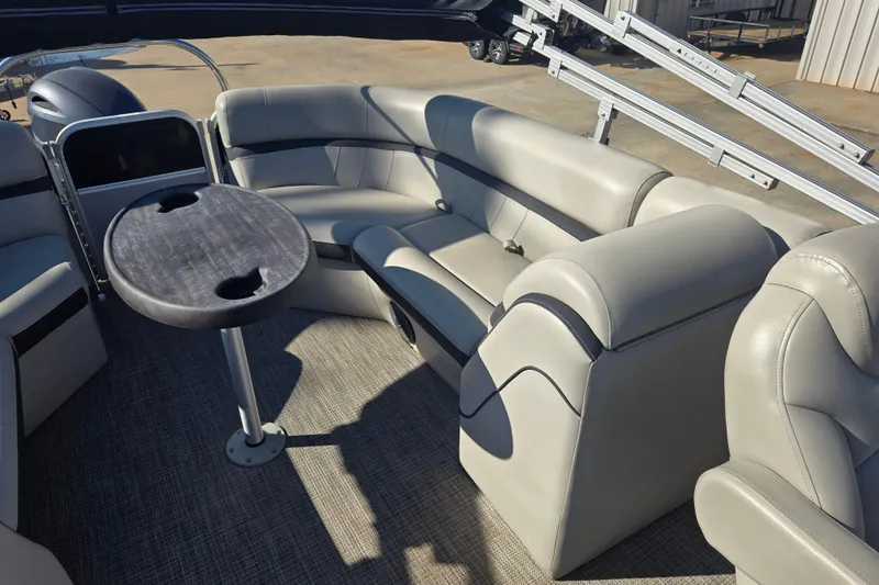 Slide: The Image of Luxurious 2018 South Bay 200 pontoon boat interior with plush seating and table. - 8
