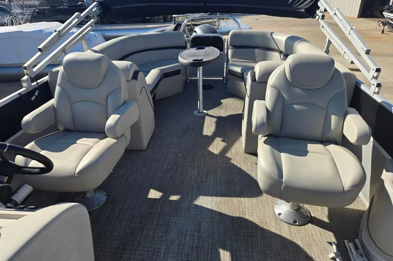 Slide: The Image of 2018 South Bay 200 boat interior with plush seating and table. - 9