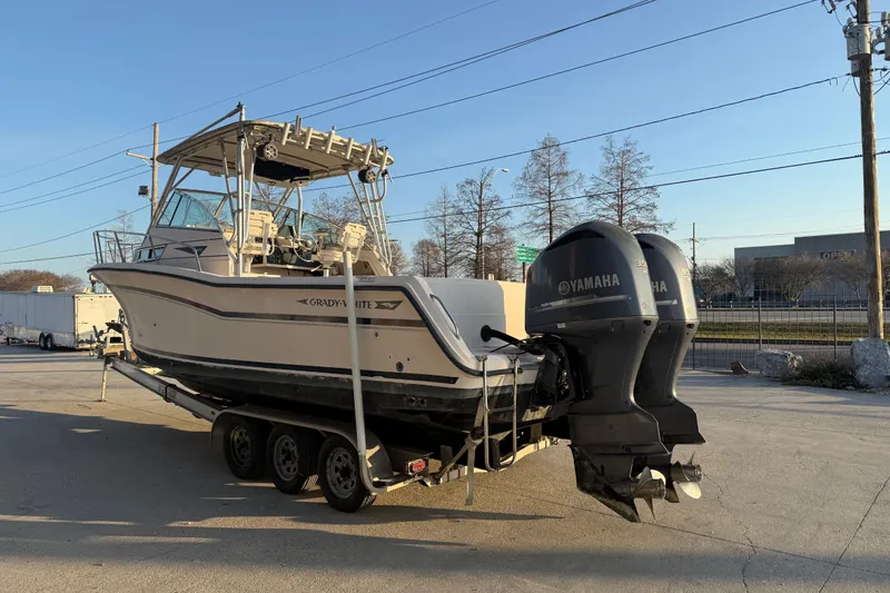 Slide: The Image of 1992 Grady White 300 Marlin boat on trailer with dual Yamaha outboard motors. - 3